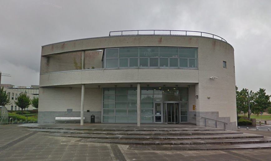 Image of Luke Wadding Library in Waterford - a large building with many windows.